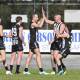Wangaratta's Michael Newton (centre) celebrates one of his five goals against Myrtleford. Picture by Mark Jesser