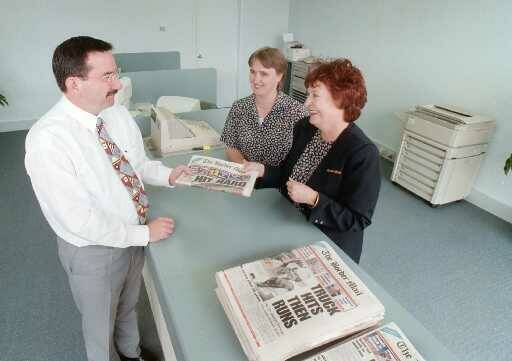 Albury-Wodonga Business Enterprise Centre manager Tony Pardy with Border Mail staff Suzy Mercieca and Liz Kolisnyk at the newspaper's Wodonga office on Stanley Street in 1998. File Picture
