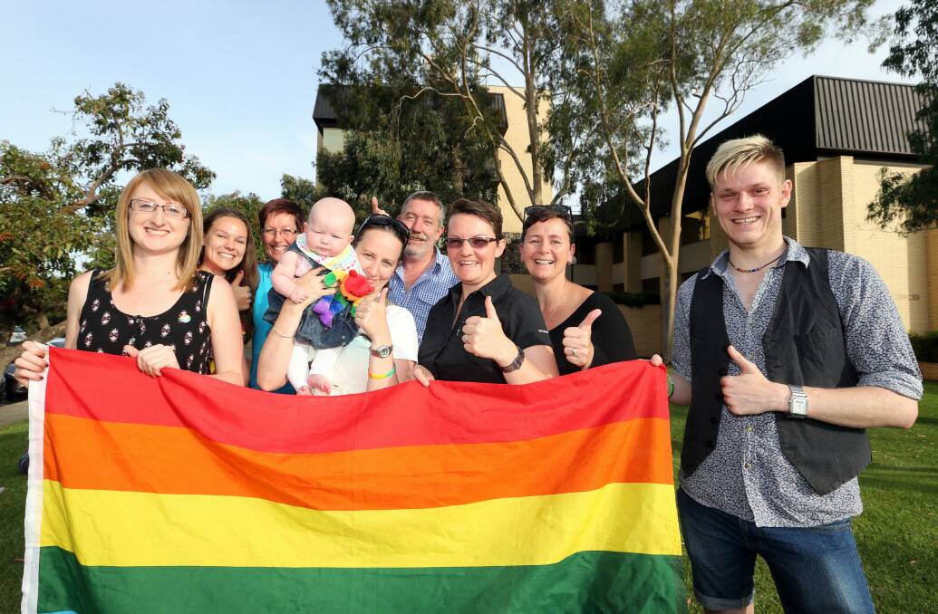 Sarah Negrin, Katherine O’Neill, Toni Johnson, Cath Prior, with four-month-old Charlie, Gary Hayward, Caz Hayman, Deb Hayman and Mark Green were delighted with Wodonga Council’s decision to publicly support same-sex marriage. Picture: PETER MERKESTEYN
