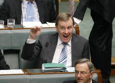 Former Treasurer, now backbencher, Peter Costello, waves at Prime Minister Kevin Rudd during House of Representatives Question Time on Wednesday March 11. Photo: Glen McCurtayne
