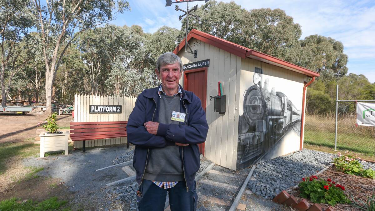 BACK ON TRACK: Peter Tolsher of Thurgoona Men's Shed standing with the newly restored Bandiana station house. Picture: TARA TREWHELLA
