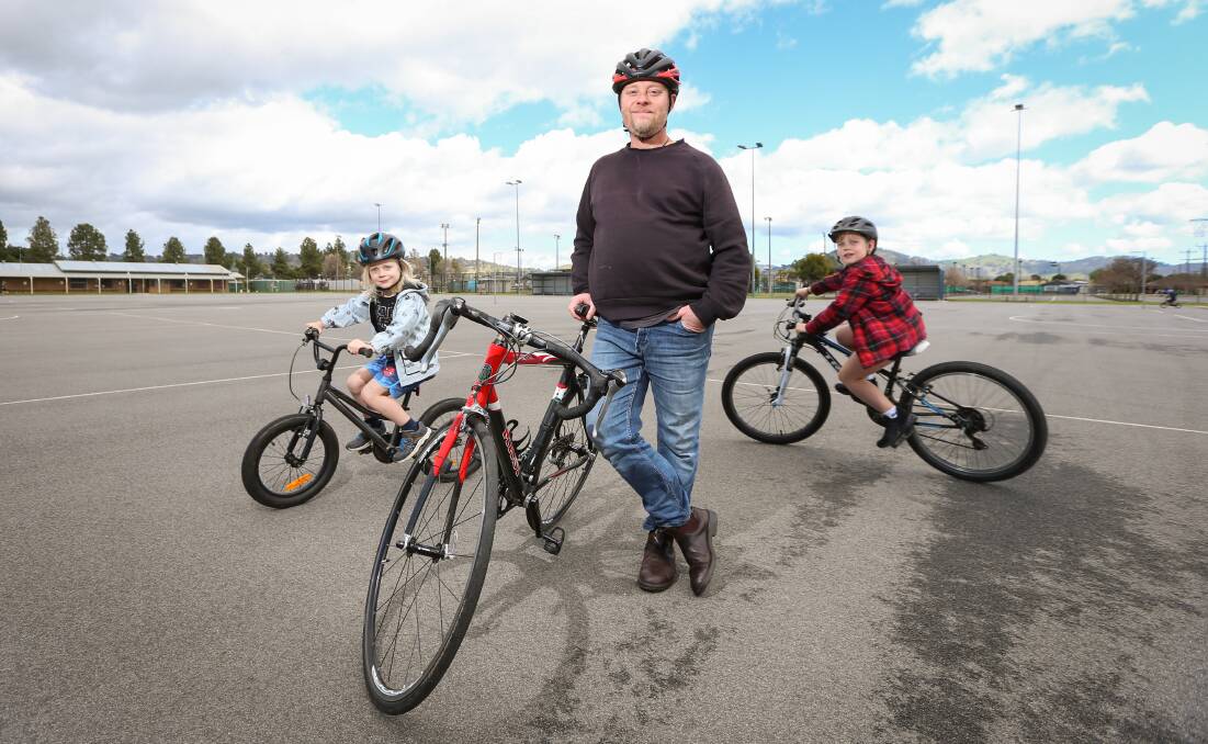 RIDING RINGS: Wodonga father Ian McLeod, with his sons Luca, 5, and Finn, 7 at Kelly Park. Picture: JAMES WILTSHIRE