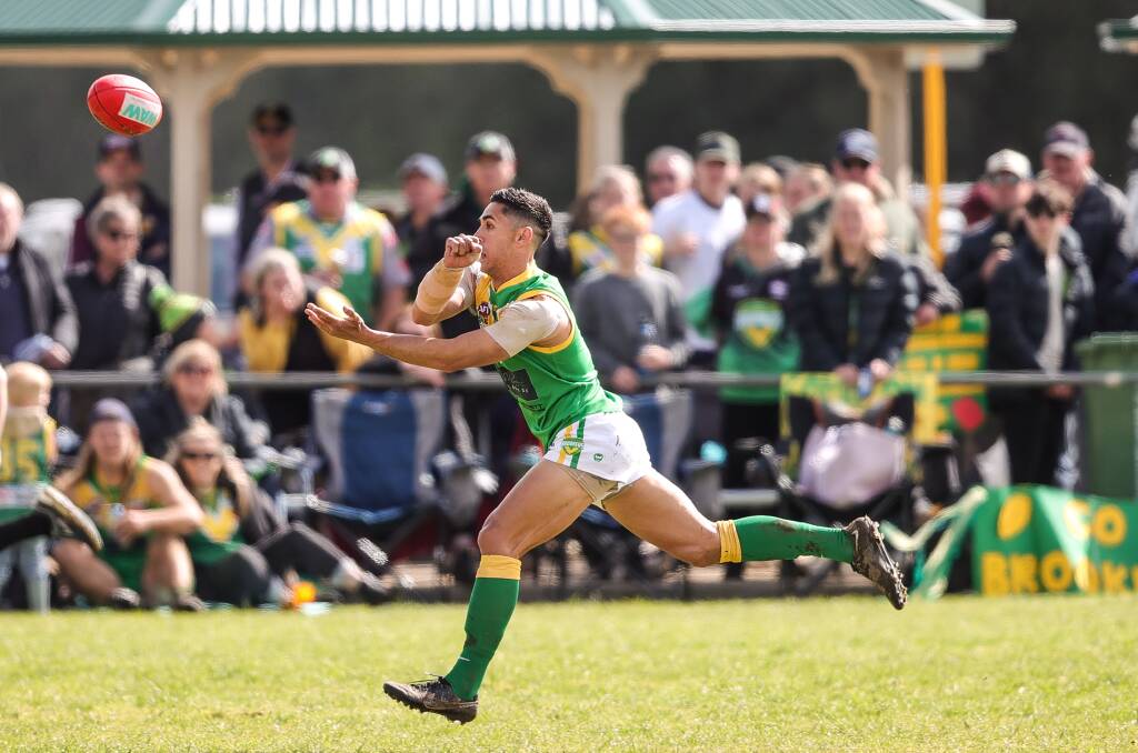 Michael Rampal fires off a handball in front of the Holbrook supporters during Saturday's grand final against Osborne. The ex-Thurgoona man played eight games in 2022 and finished with a premiership medal. Picture by James Wiltshire