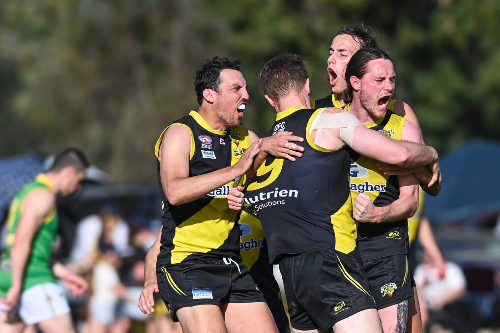 Sam Livingstone runs in to celebrate with his team-mates at the final siren. Picture by Mark Jesser