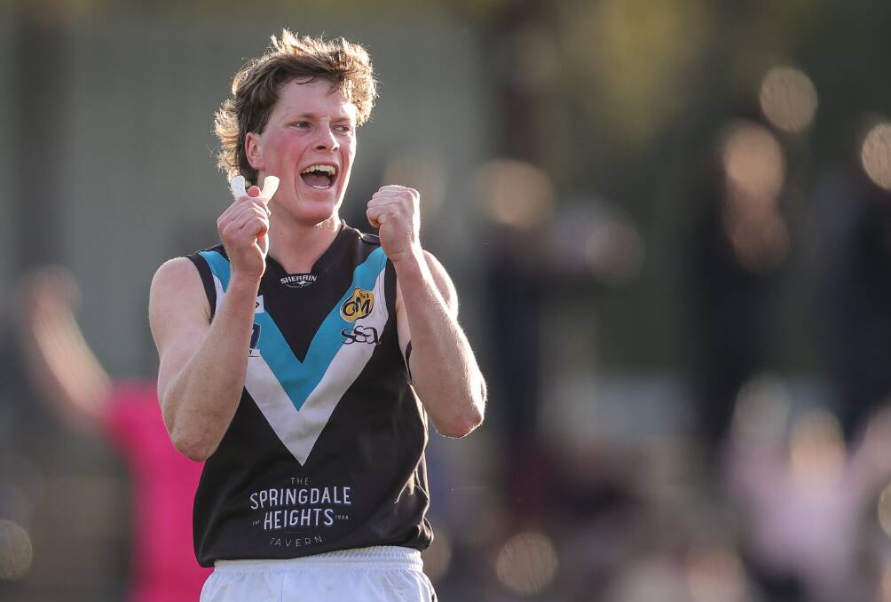 Ewan Mackinlay celebrates at the final siren of Lavington's win over Wodonga. Picture by James Wiltshire