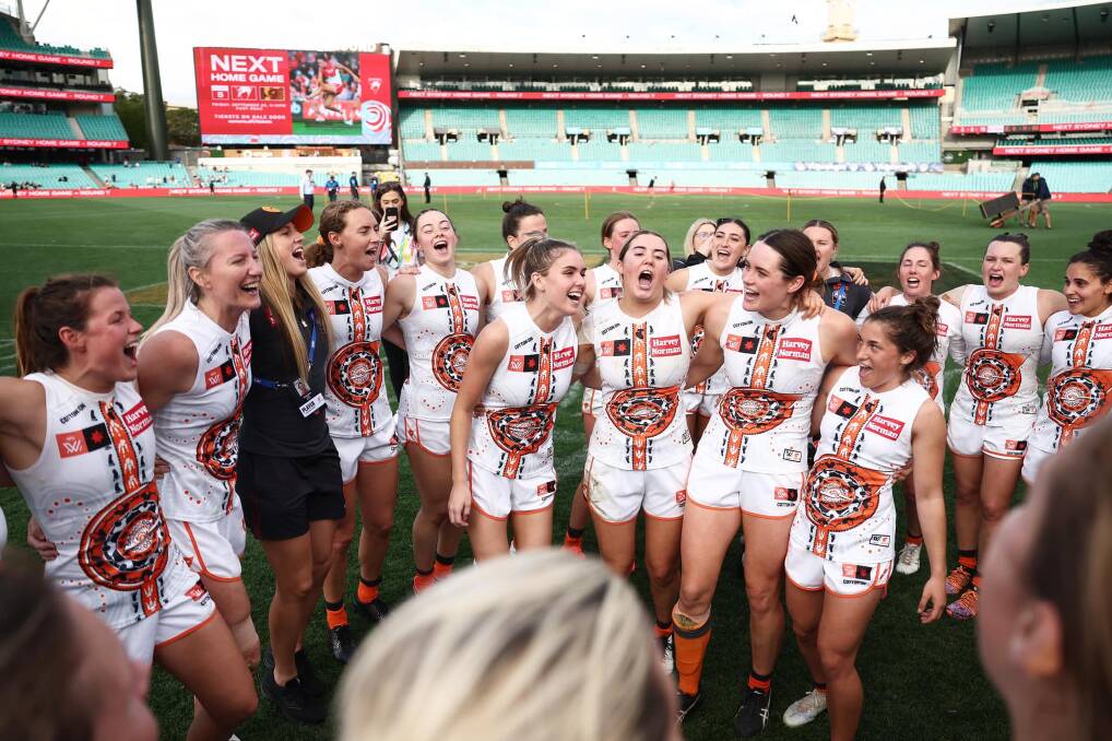 Zarlie Goldsworthy and her team-mates belt out the song. Picture by GWS Giants