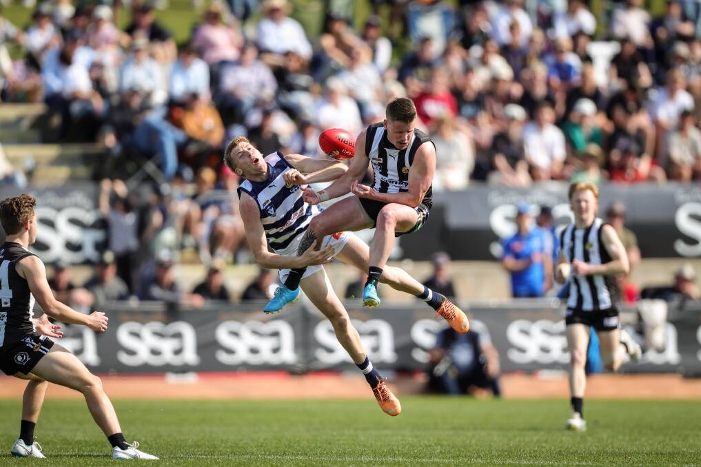 Caleb Mitchell and Mark Anderson collide in mid-air during the Ovens and Murray grand final. Picture by James Wiltshire