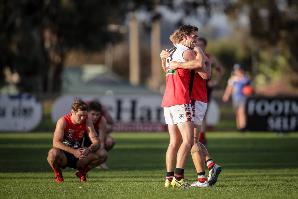 Hugh Wales and Jake Sharp celebrate Myrtleford's win over Wodonga Raiders in 2019. Picture by James Wiltshire