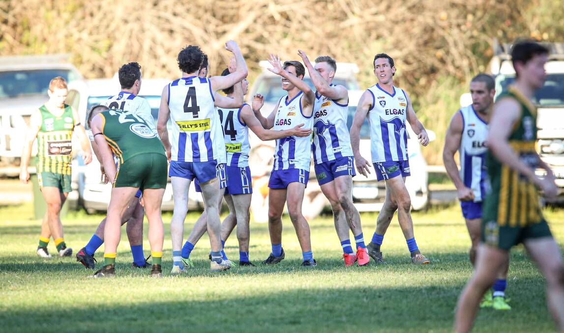 Yackandandah celebrate one of their 16 goals against Tallangatta. Picture: JAMES WILTSHIRE