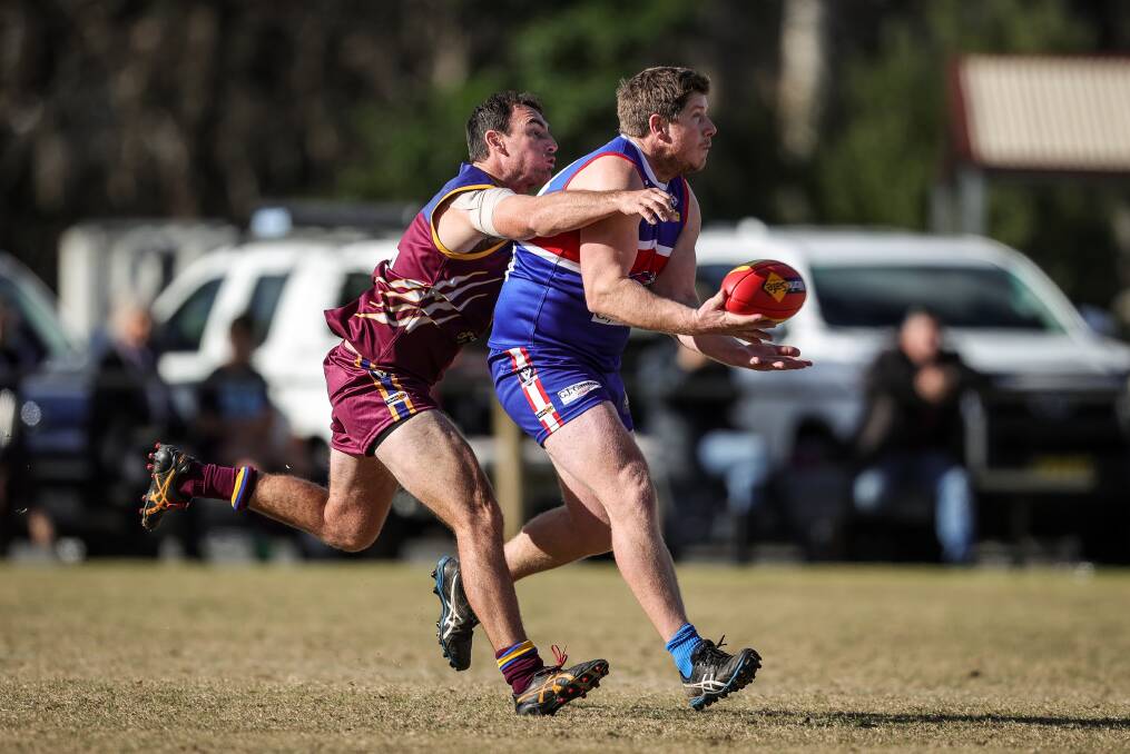 Jake Bruce gets in front of Beau Connell to take a mark during Thurgoona's 28-point win away to Wahgunyah on Saturday. The Bulldogs are only outside the top-five on percentage after 11 rounds. Picture by James Wiltshire
