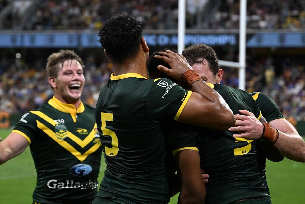Australia's players celebrate one of their tries against Samoa on Saturday.