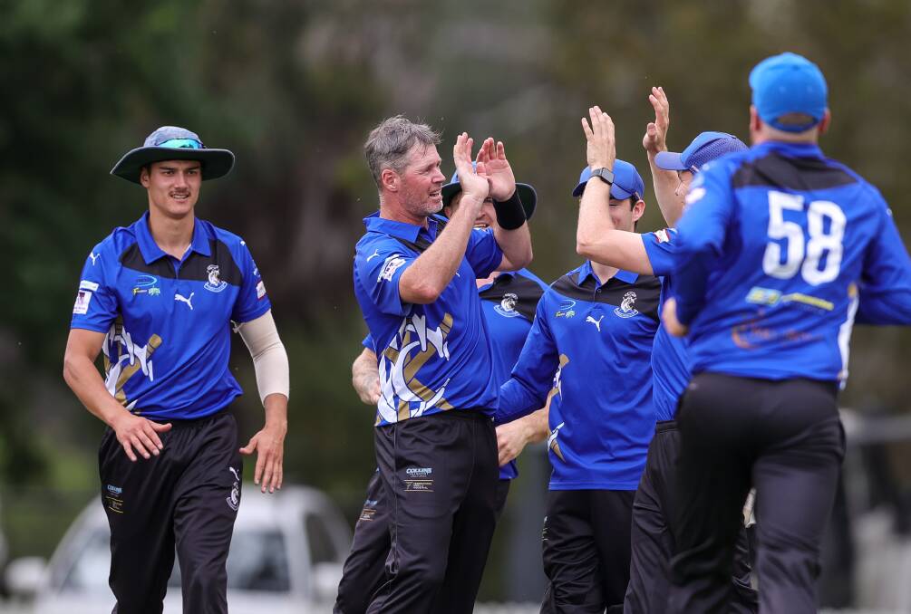 Dan Christian celebrates the wicket of Neil Smith with his new Corowa team-mates. Picture by James Wiltshire