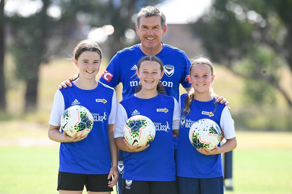 Poppy, right, with Melbourne Victory coach Jeff Hopkins.