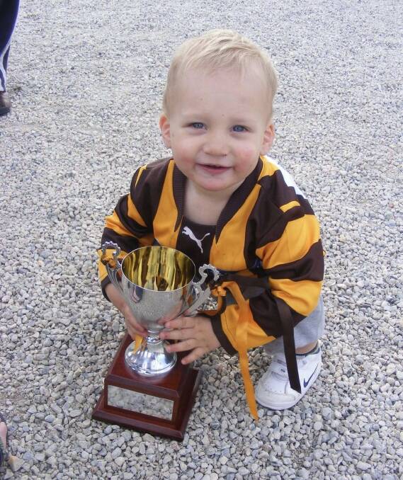 One-year-old Jake Knight with the premiership cup in 2008.