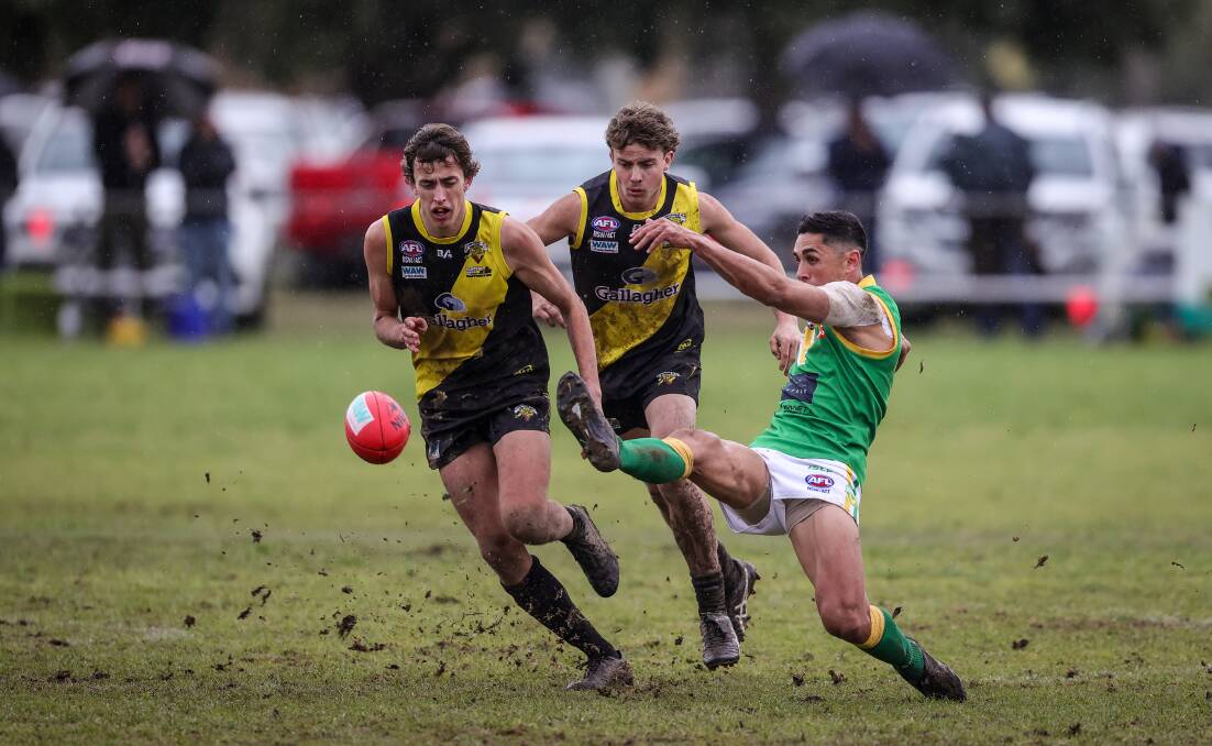 Michael Rampal knocks the ball forward in the grand final against Osborne. Picture by James Wiltshire