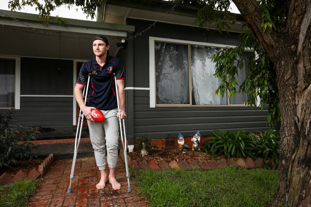 Mitch Thomas on crutches after injuring his knee for a second time. Picture by James Wiltshire
