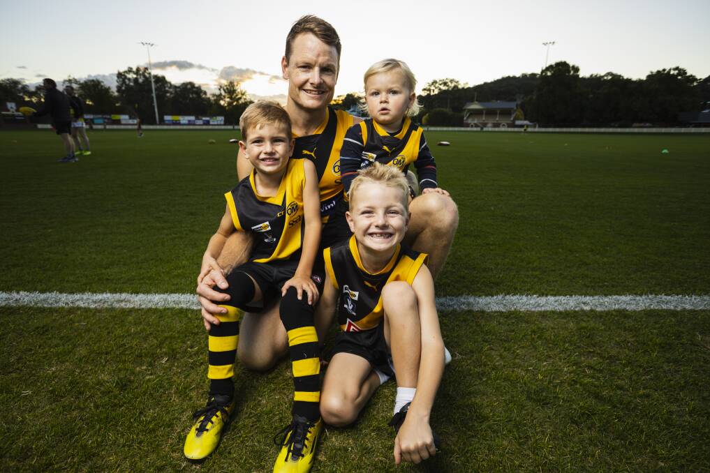 Luke Daly with sons Jack, Harry and Harvey ahead of his 250th game for Albury earlier this year. Picture by Ash Smith