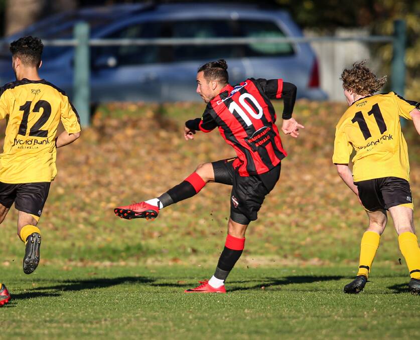 PERFECT 10: Adam Burchell slots the first goal of his hat-trick against Albury Hotspurs on Sunday. That treble took him to 16 for the season. Picture: JAMES WILTSHIRE