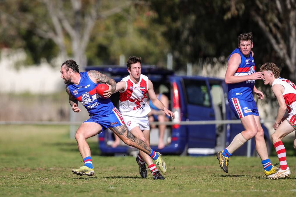 Trent Castles takes off with the ball for Jindera. Picture by James Wiltshire
