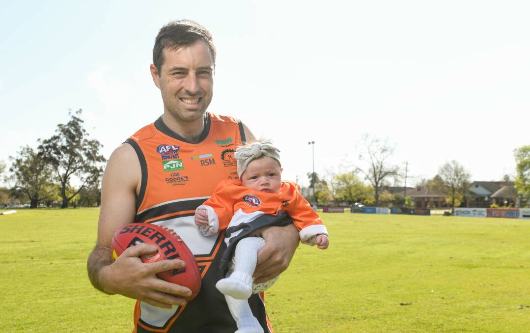 Tom Plunkett with his eight-week-old daughter Macey. Picture by Tara Trewhella