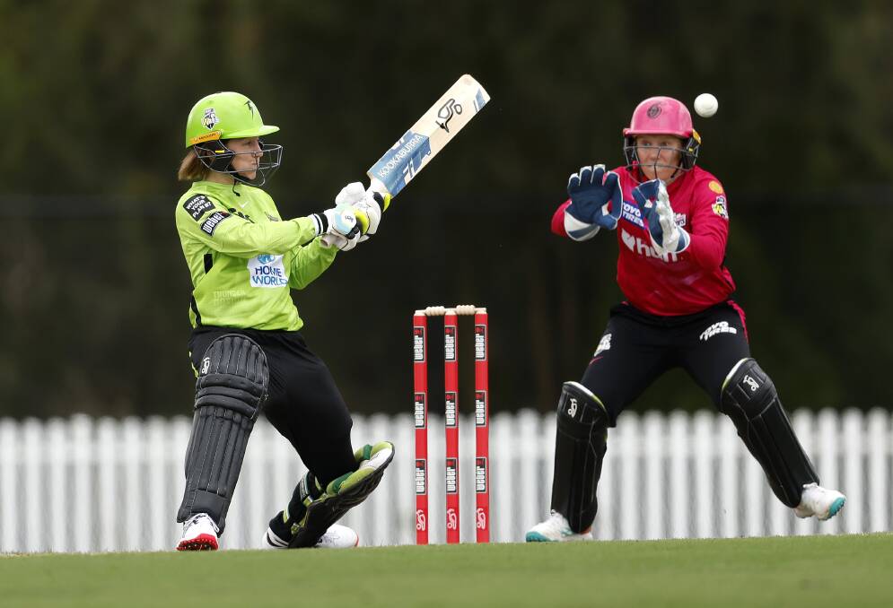 Rachael Haynes plays a reverse sweep as Alyssa Healy looks on during the WBBL practice match between Sydney Thunder and Sydney Sixers. Picture by Phil Hillyard