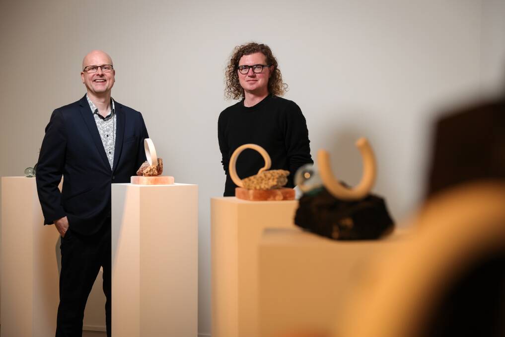 NEW DISPLAY COMING: Mercy Connect chief executive Trent Dean and MAMA curator Michael Moran at the exhibition by North East artist Julianne Piko, one of last year's Open Call featured artists. 