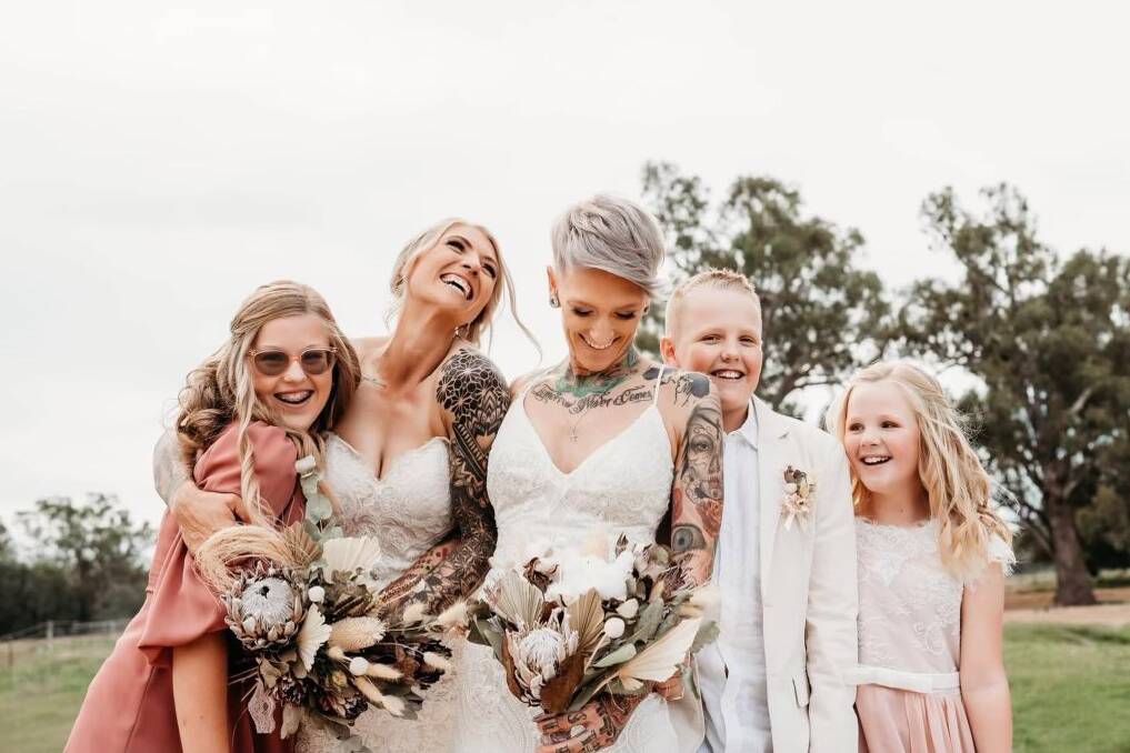 Tammie with her wife and three children at their Wedding in March 2022.