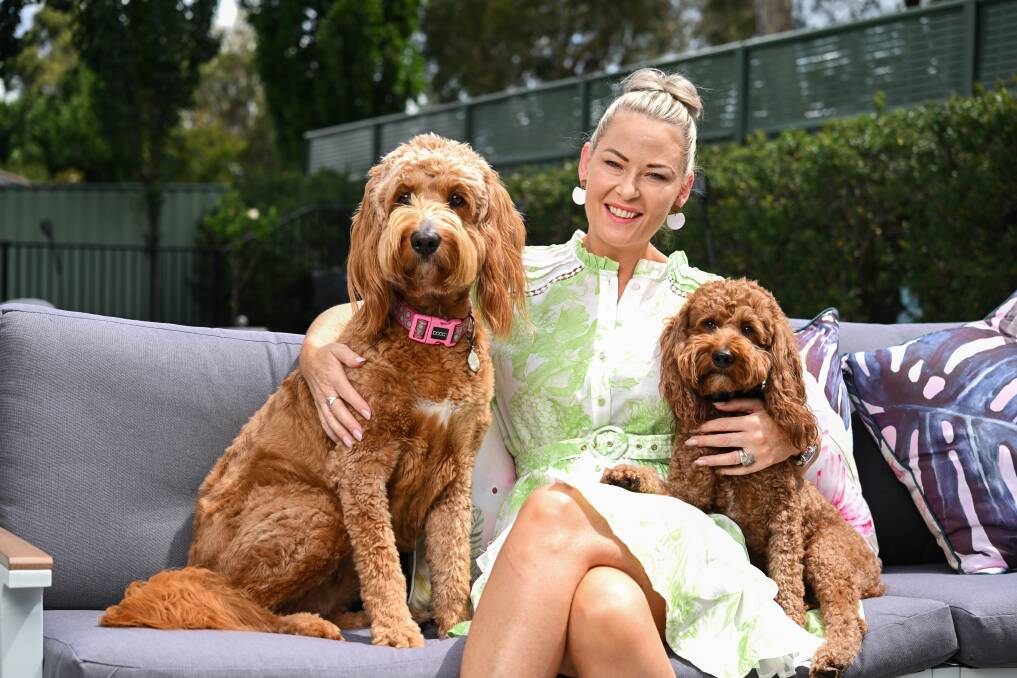 Brownyn Robertson with her dogs Coco and Sammy. She says it's important to say yes to opportunities in life. Picture by Mark Jesser.
