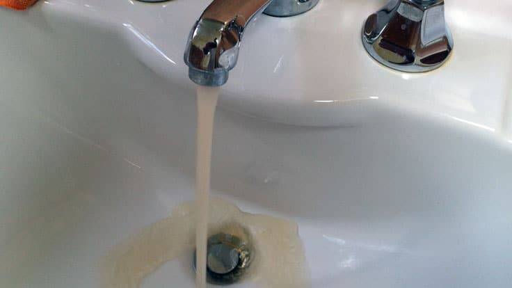 A photo shared on social media showing the discoloured water of a Border resident's bath.