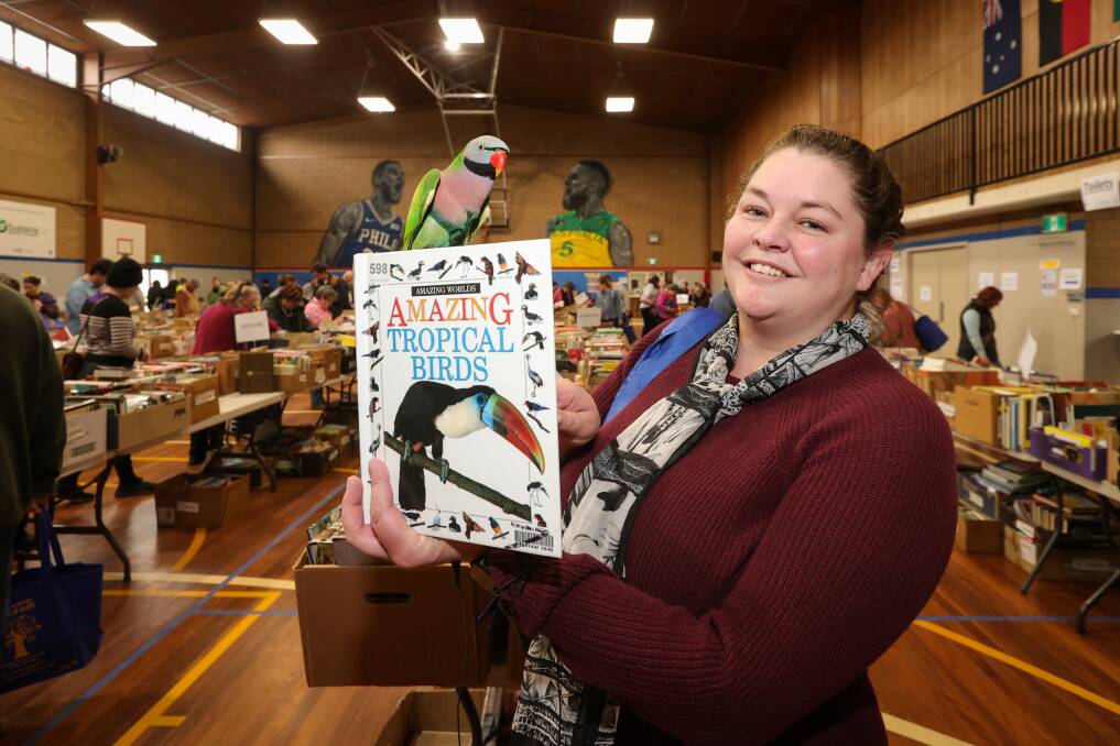 Albury woman Mel Cooper and her 20-year-old moustached parakeet, Zazu, were among the 800-strong crowd to flock to the first Rotarian-organised book fair for the Albury-Wodonga region. Picture by James Wiltshire