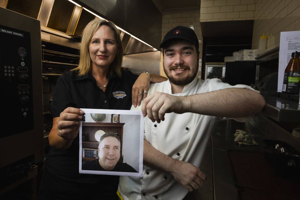 Edwards Tavern publican Katrina Donelan and chef Bronson Rautenberg-Tankard with an image of Bruce Edwards in the pub's kitchen. Picture by Ash Edwards