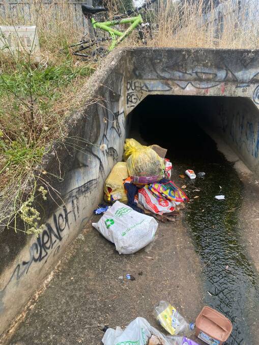 Residents say the drain area connecting to Kaitlers Road was filled with garbage, abandoned bicycles and shopping trolleys until the council cleaned it up last week. Picture supplied. 