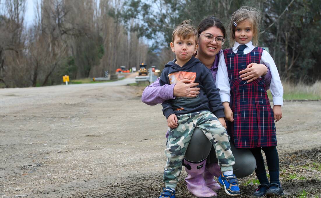 Kurrawamby mum Winnie Bulle, with her children Jaden, 3 and Aquata, 5, make their way across road-widening works at Jingellic Road at Wantagong which has been described as the "worst in Greater Hume Shire". Picture by Mark Jesser
