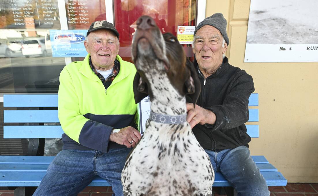 Jim Murphy, 80, Remy, 2, and Ross Gladstone, 80, outside Ritchies IGA at Beechworth on Wednesday, June 19. Mr Murphy and Mr Gladstone both signed Maggie Mackenzie's petition to support the establishment of an indoor community pool for Beechworth. Picture by Mark Jesser