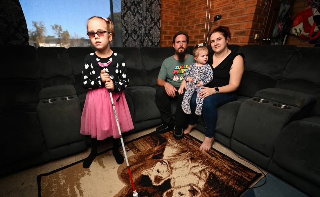 Legally blind Baranduda student Zoe Bohun, 7, with her dad Laurence, mum Cynthea Bohun and sister Connie, 3. Picture by Mark Jesser