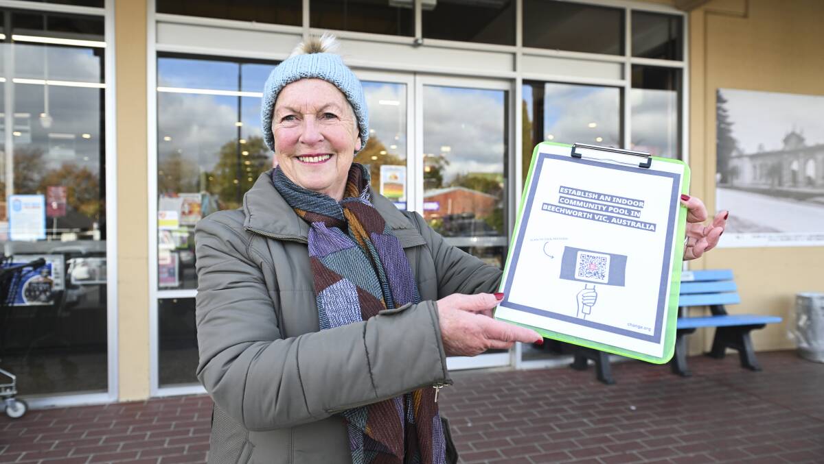 Stanley businesswoman Maggie Mackenzie spent a chilly morning gathering signatures outside the Beechworth IGA. At 11am, after 30 minutes, she had added 10 signatures to the 455 already signed online. Picture by Mark Jesser 