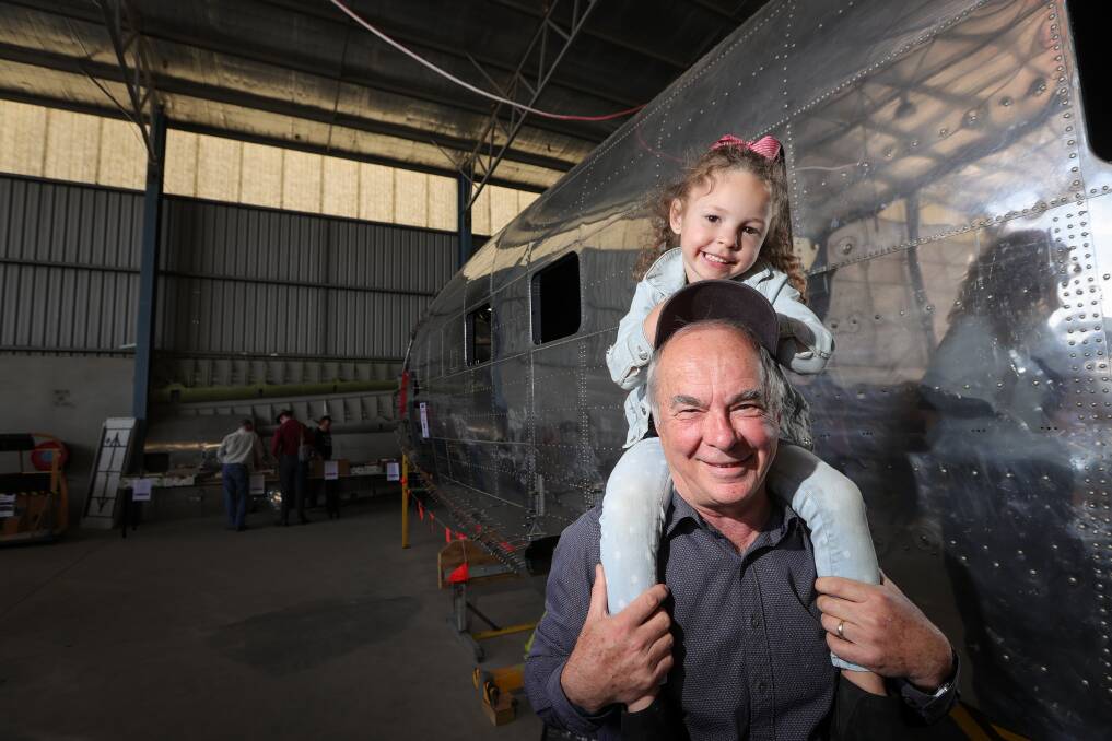 Harry Nyman and his granddaughter Scarlett Day, 4, from Albury enjoy the Uiver open day at the airport on October 28. Picture by James Wiltshire