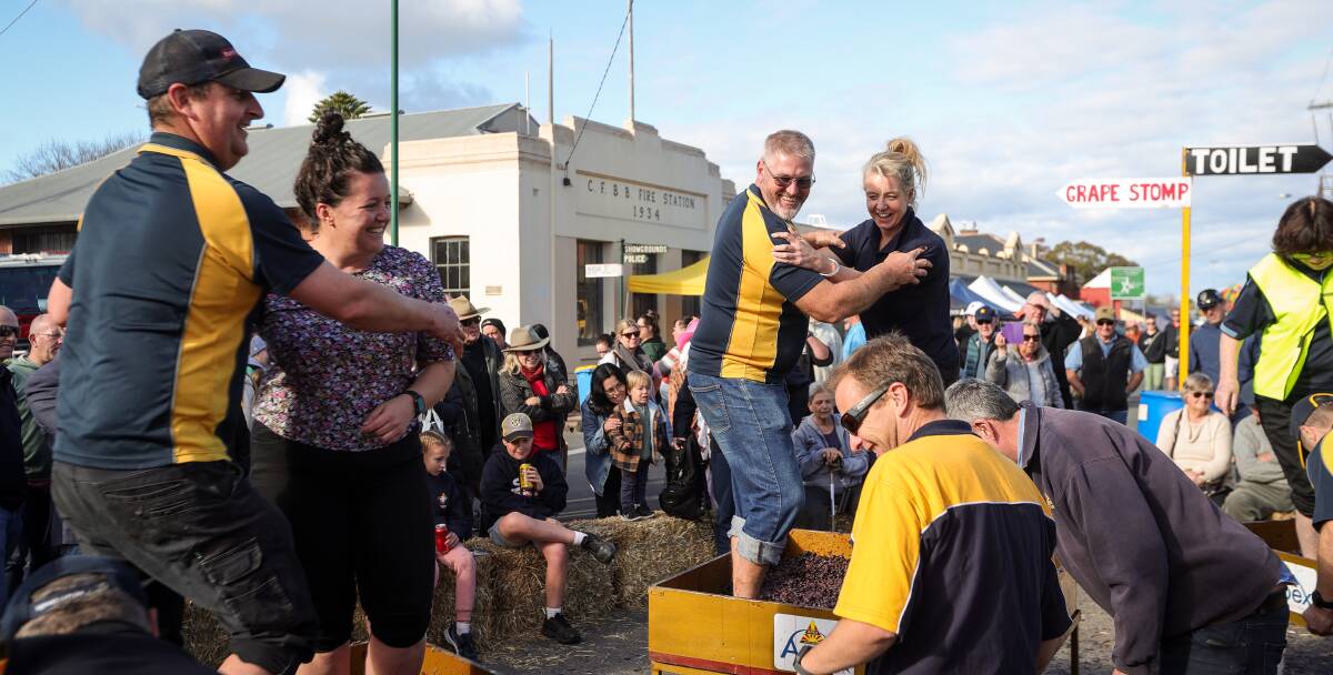 Mark Chandler and Sophie Price compete with Jamie Cooper and Bridget McKenzie in the grape stomp. Picture by James Wiltshire