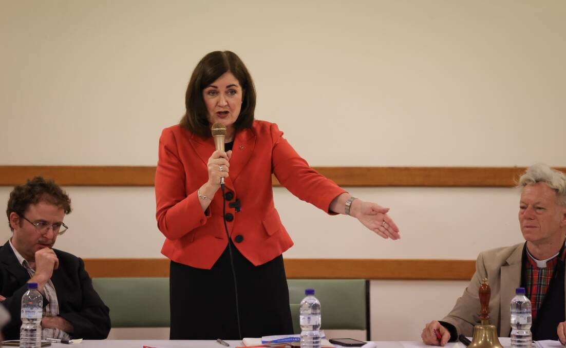 Victorian Senator Sarah Henderson, with Damien Freeman, left, and Father Peter MacLeod-Miller, speaks at Wangaratta's CWA Hall on Tuesday night. Picture by James Wiltshire