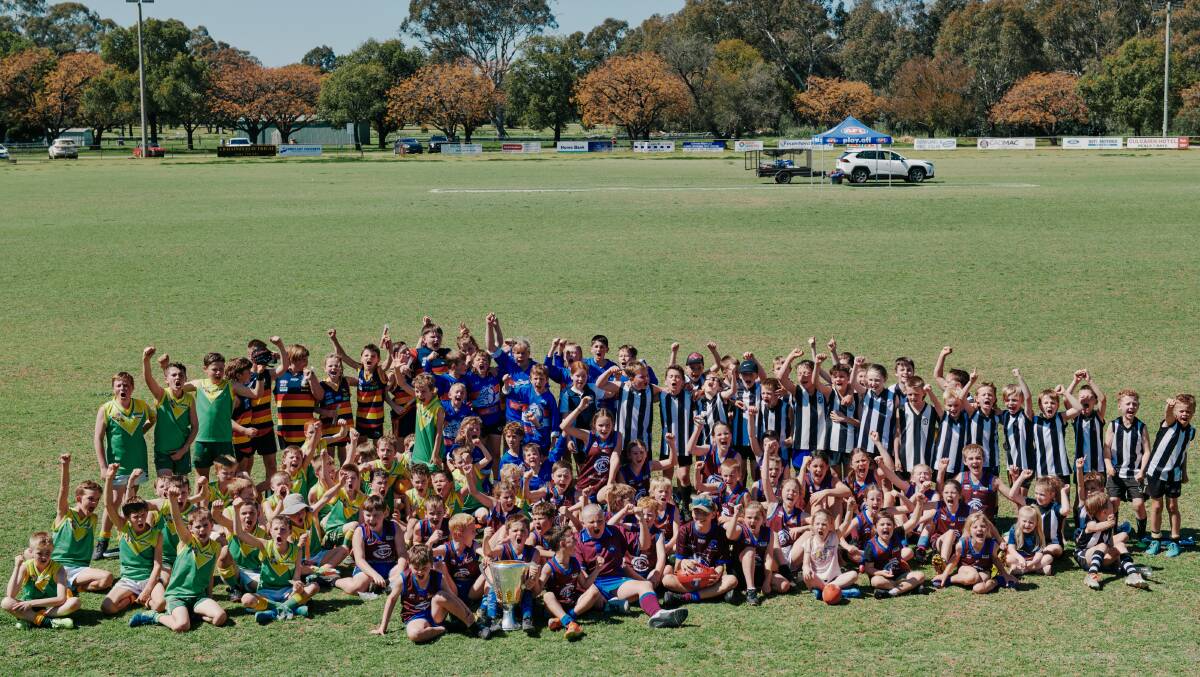 Hundreds turned out n Sunday to play footy and get a close-up look at the AFL Premiership Cup. Picture by Chris Gurney
