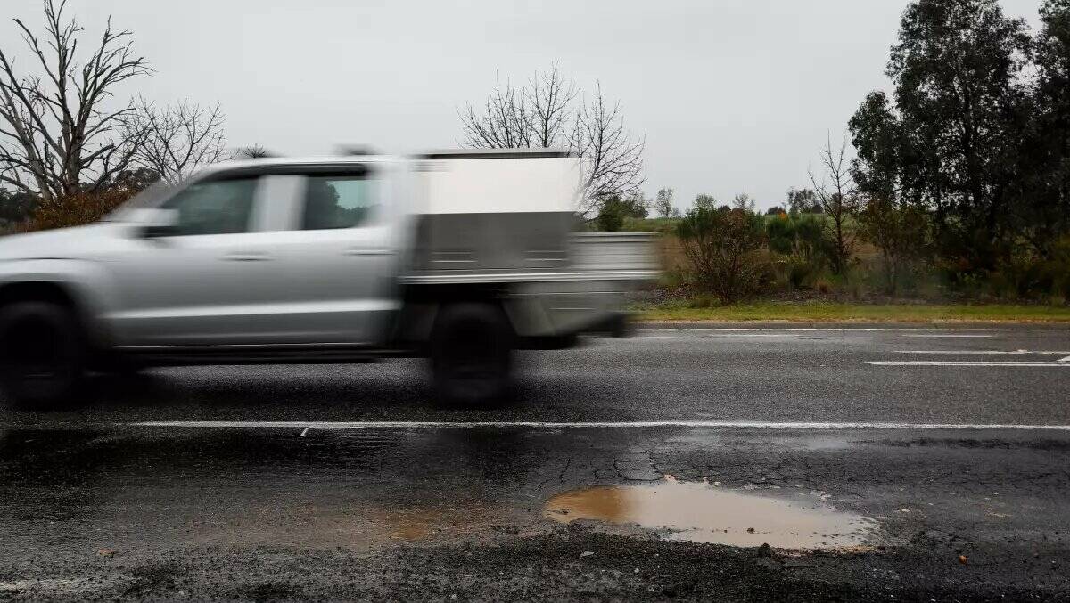 Cars swerve to avoid potholes on Beechworth-Chiltern Road. Picture by James Wiltshire