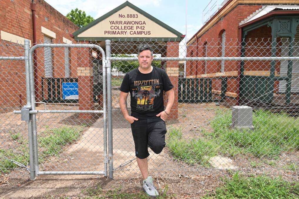 Daine Runnalls outside his old primary school which he says has been fenced off and not used in more than 10 years. Picture by Mark Jesser