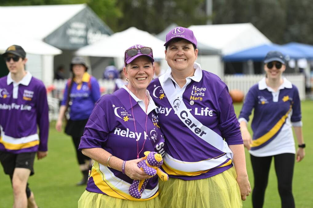 Sonia Cooper and Tracey Hill walk for team Rothmore at Saturday's Relay for Life event at East Albury. Picture by Mark Jesser