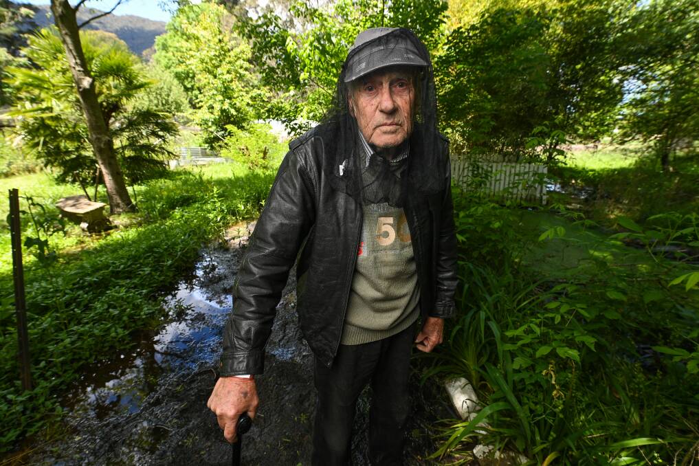Bernard Eden's back yard has "turned into a swamp" after weeks of heavy rain. He suspects he was infected by the swarms of mosquitoes now inhabiting his garden. Picture by Mark Jesser