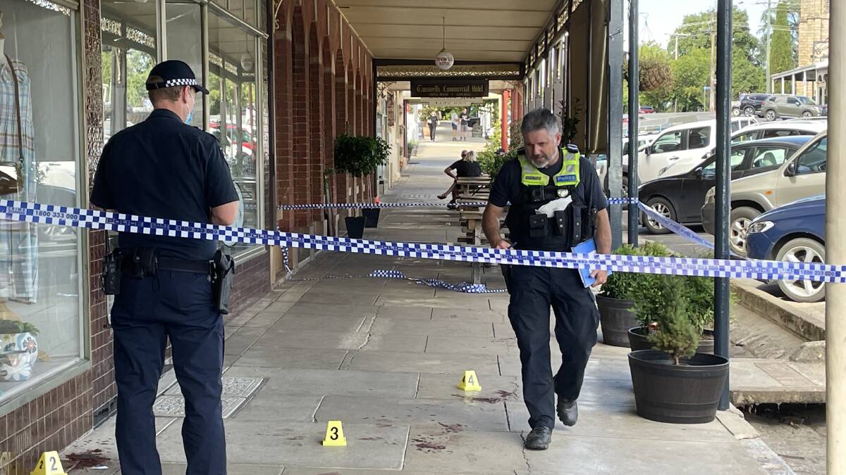 Police examine the scene near Tanswell's Commercial Hotel at Beechworth on Friday morning. Picture by Ted Howes
