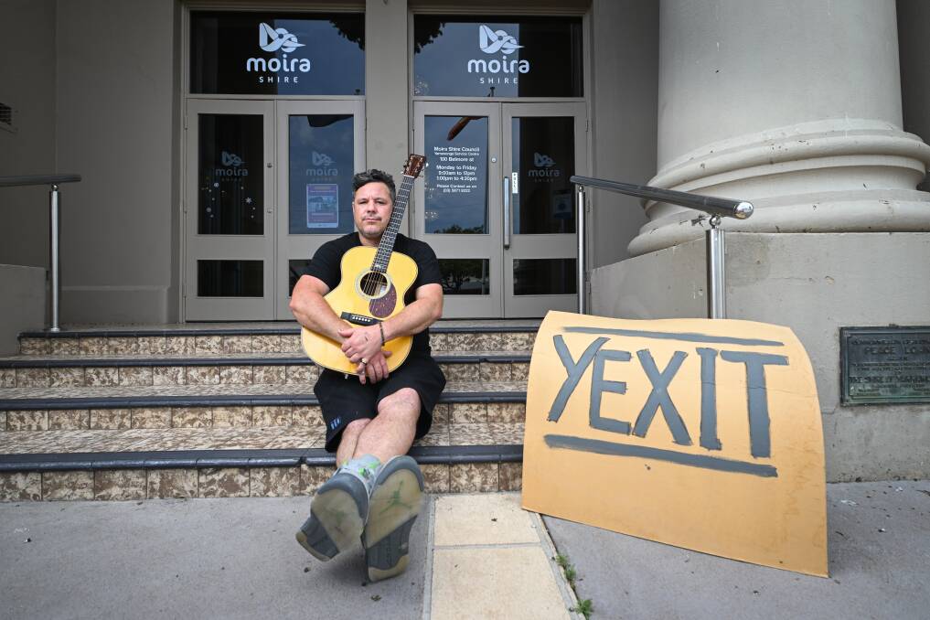 Musician and activist Daine Runnalls, pictured outside Yarrawonga's old town hall, has written a protest song to support a push for the town to withdraw from Moira Shire Council. Picture by Mark Jesser