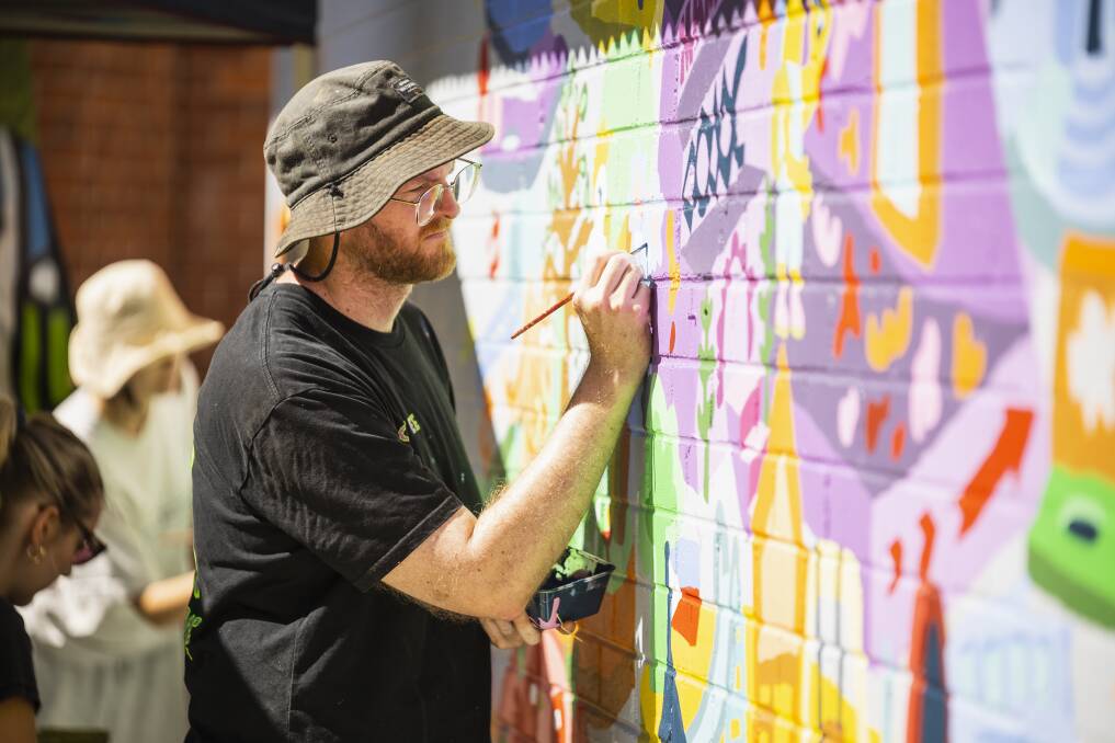 Colour-loving artist Jeff McCann said seeking community input to the design of the Albury World mural was vital to making the work relevant and accepted. Picture by Ash Smith.