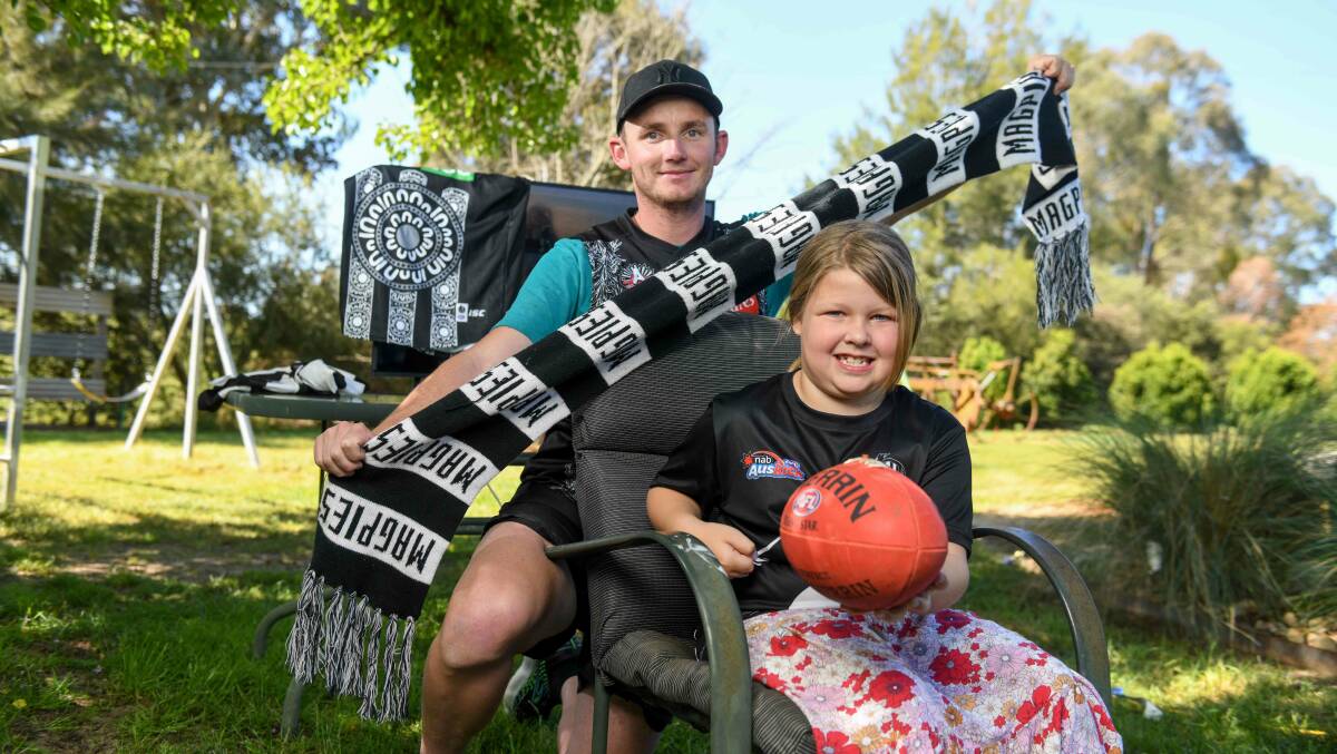 Allans Flat resident Matt Williams and his seven-year-old daughter Piper are feeling ecstatic after Collingwood claims 16th premiership. Picture by Tara Trewhella