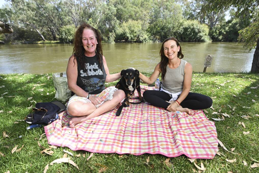 Wodonga's Karlie Langdon with her dog Bailey and friend Sally Starkey of Ocean Grove at Noreuil Park. Picture by Mark Jesser