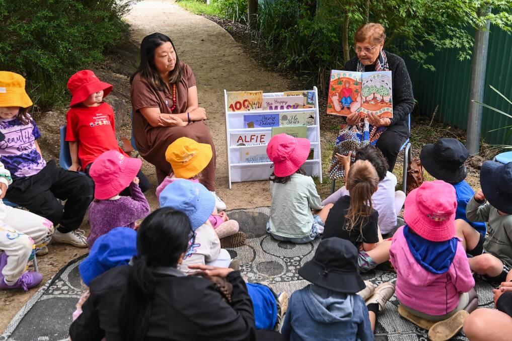 Koori Kindermanna Preschool students gather round to hear Aunty Edna Stewart read My Feet. Picture by Mark Jesser
